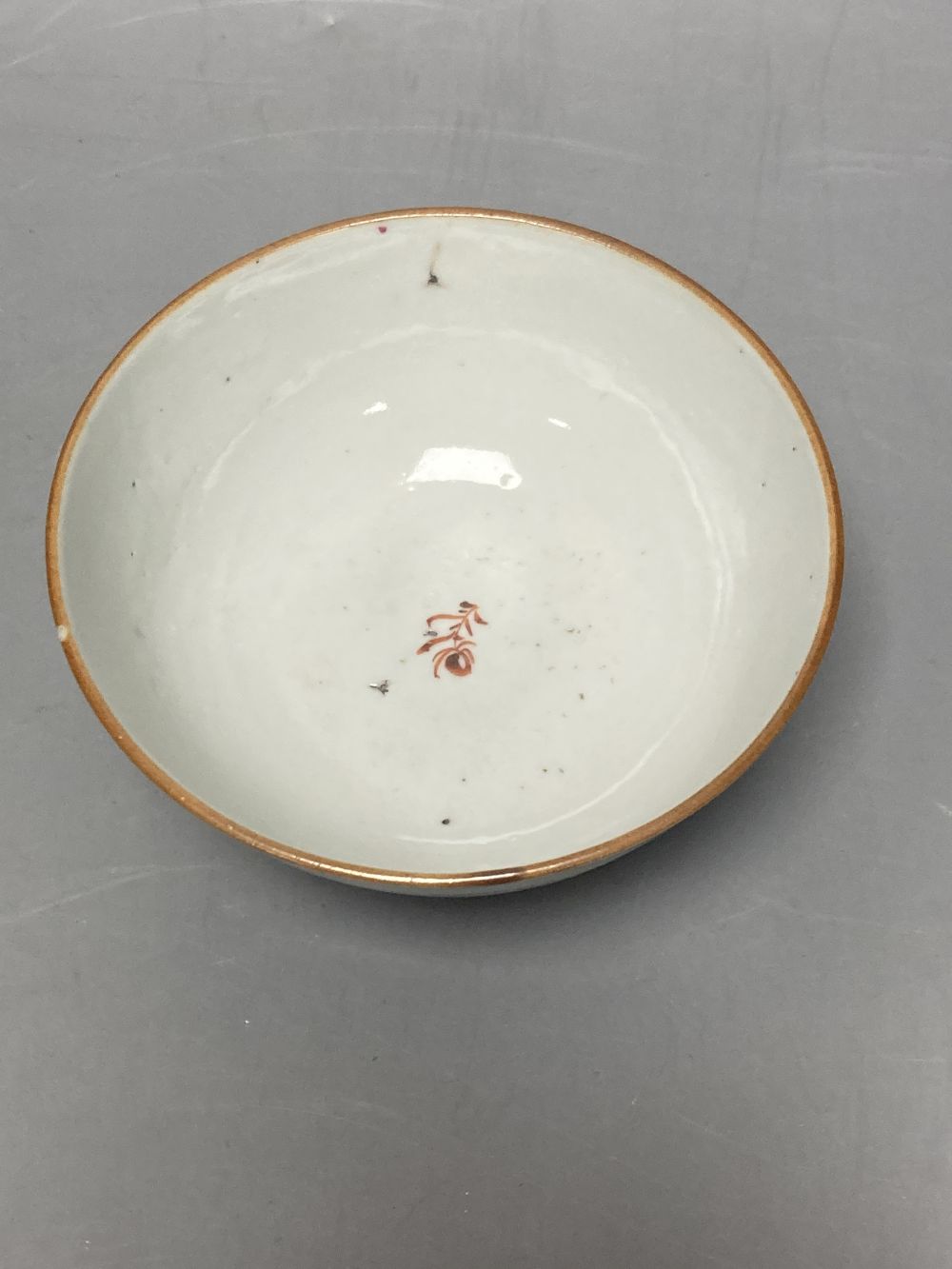 An 18th century Chinese famille rose bowl, 11.5cm diameter, and three smaller Chinese porcelain bowls